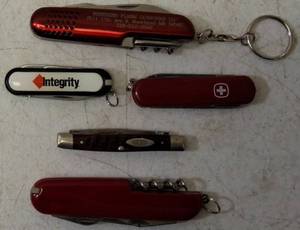lot 13 image: Pocket Knives - (1) Northern Plains Gunworks Red Multi Tool Pocket Knife (1) Integrity - Knife  Scissors (1) Small Swiss - Blade  scissors (1) Case - Brown Handle Pocket Knife (1) Red Multi Tool Pocket Knife (View Photos)