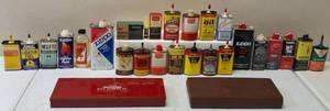 lot 31 image: Assortment of Vintage Gun Oil & Lighter Fluid (Cans Might not be Full or Empty), Gun Cleaning Kits & Bonus Vintage Avon - Ammo Shaped Aftershave Bottles (May or they May not be full)  Vintage Pineapple Extract Bottle (View Photos)