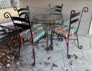 lot 5 image: Stylish Wrought Iron Patio Table with Four Chairs