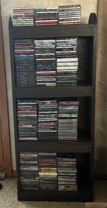 lot 234 image: Collection of CDs including Aerosmith, The Best of the Animals, Micheal Jackson, Eric Clapton and More with Shelf