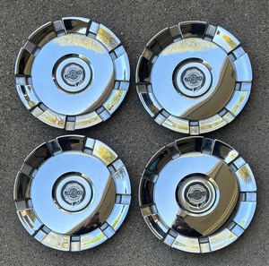 lot 120 image: Miniature Chrysler Hubcaps