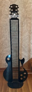 lot 160 image: Guitar Shaped Metal CD Holder
