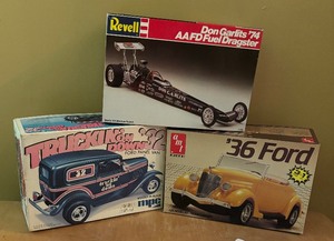 lot 197 image: AMT Ertl 1936 Ford, Revell Don Gardist 1974 AAIFD Fuel Dragster and MPC Trucken on Down Model Car Kits