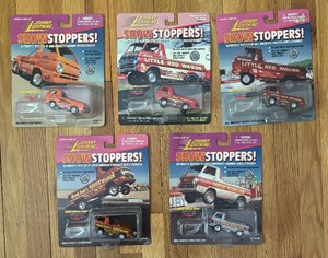lot 75A image: New Johnny Lightning Show Stoppers Trucks including Billy Goldens Little Red Wagon, Bob Riggles Famous Wheel-Stander and More