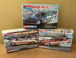 lot 274 image: Three New Monogram Snap Tite Model Car Kits including Pepsi Challenger, Blue Max and Budweiser King