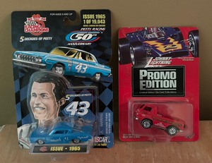 lot 402 image: Johnny Lighting Promo Edition Little Red Wagon and Racing Champions Petty Racing Car