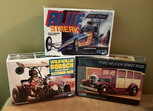 lot 389C image: New Car Model Kits MPC Blue Streak Rear Engined Dragster, Monogram Ford Woody Street Rod and MPC Willie Borsch Winged Express Altered Rod