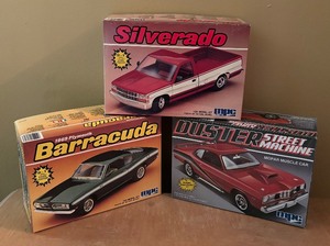 lot 410 image: MPC Duster Street Machine Chevrolet C-1500, Silverado Pick Up Truck and 1969 Plymouth Barracuda Model Car Kits