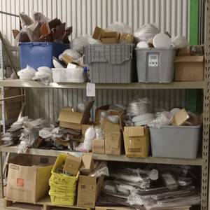 lot 28 image: HUGE lot of fan parts, fan blades, glass etc. These are smoking hot sellers on ebay (racks not included in sale)