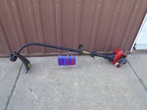 Craftsman 2 cycle curved shaft weed trimmer. Fires on ether. As shown.