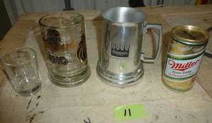 lot 11 image: Hamms tankard, Miller lite beer can bank, shot glass, glass mug from MGM Grand