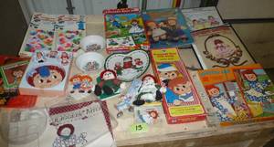 lot 13 image: Large lot of Raggedy Ann books, dolls, mini tea set, dishes