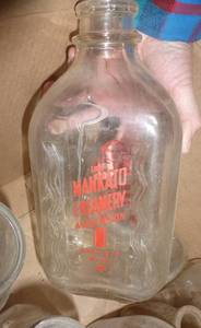 lot 75 image: Box of vintage milk bottles