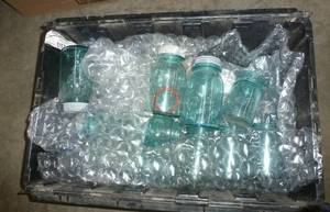 lot 76 image: Tote full of blue jars 18 total