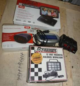lot 90 image: Portable DVD player, alarm clocks and worklight