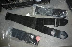 lot 112 image: 50 guitar straps in a cardboard drum case