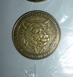 lot 149 image: 75 grizzly and 75 black bear coins