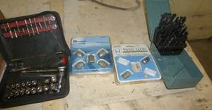 lot 159 image: lug nuts, drill bits, small socket set