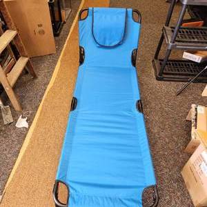 lot 26 image: New Open Box Royal Blue Outdoor Furniture That Functions As Both A Cot And Lounge Chair