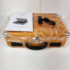 lot 31 image: NEW JORLAI T316 Portable Suitcase Turntable Orange