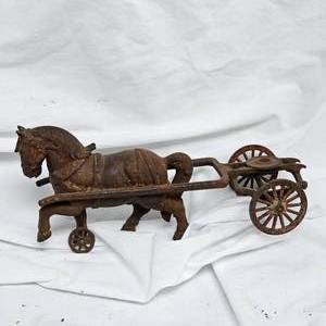 lot 45 image: Late 1800s Early 1900s Cast Iron Horse Drawn Cart, Shows Hint of Orange Paint on Cart