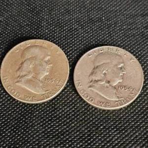 lot 109 image: (2) 1954 Franklins 50c