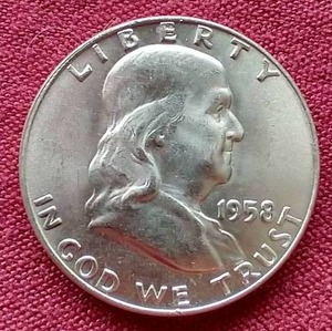 lot 13 image: Nice Uncirculated 1958-D Franklin Half Dollar