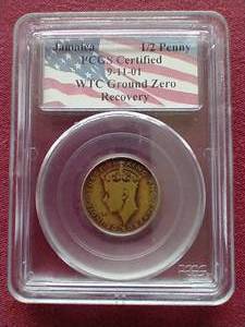 lot 18 image: Jamaica 12 Penny Coin Recovered From World Trade Center Ground Zero