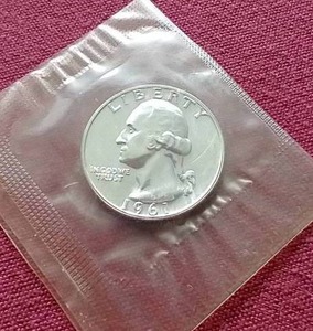 lot 87 image: Sealed 1961 Uncirculated Silver Quarter
