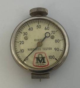 lot 54 image: Vintage Rubber Hardness Tester With Myers Tire Supply Advertisement (Plastic Face Plate Loose)