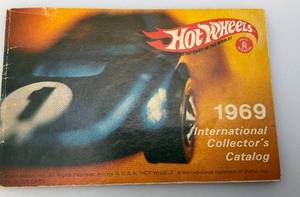 lot 129 image: 1969 Hot Wheels International Collectors Catalog By Mattel (In Protective Sleeve)