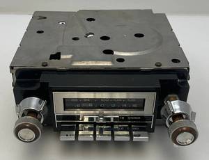 lot 261 image: Vintage 1970s-80s DELCO  Car Stereo Radio With Bakelite Wood Grain Knobs (Untested)