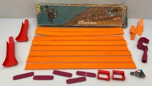 lot 322 image: 1970s RRRumblers Stunt Rider Set In Original Box (Box Beat Up & Complete With Motorcycle & Driver)