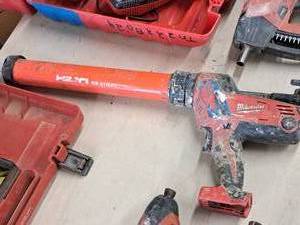 lot 889 image: Milwaukee 18V Caulk and Adhesive Gun 2640-20 with Hilti Firestop Foil Pack Dispenser CS-270-P1