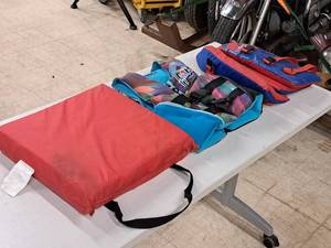 lot 1005 image: (2) Life Jackets Youth Size and (1) Seat Cushion