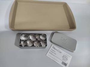 lot 77 image: Pampered Chef Stoneware Pan & Cookie Cutters