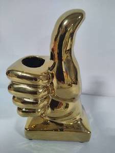 lot 31 image: Thumbs Up Brass Pencil Holder