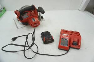 lot 89 image: Milwaukee 6.5 Circular Saw with battery and Charging Block