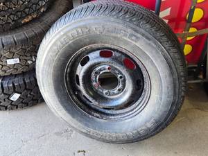 lot 16 image: Ameri GTS60 P20575R15 Tire with Steel Rim
