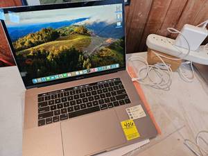 lot 406 image: REFURBISHED MACBOOK PRO