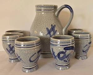 lot 34 image: Stoneware Pitcher & Drink Set