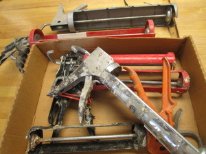 lot 149 image: Caulking guns regular & quart size...