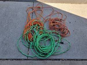 lot 24 image: Collection of Outdoor Extension Cords - Assorted Lengths