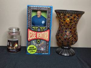 lot 54 image: Collection of Decorative Hurricane Vase, Village Candle, and Jesse Ventura Action Figure