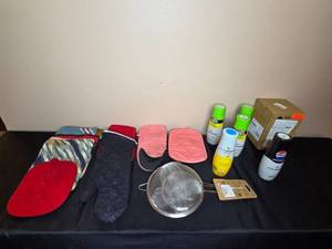 lot 76 image: Kitchen Essentials Collection Oven Mitts, Cooking Spray, and Strainer