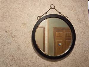 lot 124 image: Round Wall Mirror with Black Frame and Metal Hanging Accents