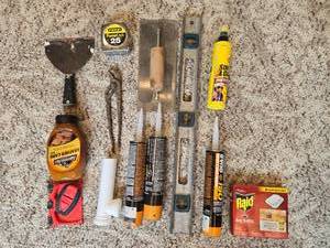 lot 193 image: Assorted Home Improvement and Cleaning Supplies with Holiday Stocking
