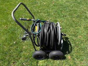 lot 217 image: Heavy-Duty Garden Hose Reel Cart with Dual Wheels and Nozzles