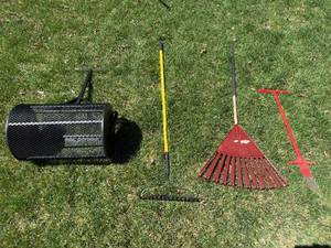 lot 223 image: Lawn Care Tool Set with Spreader, Rakes, and Sod Cutter
