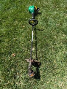 lot 243 image: Weed Eater FeatherLite SST25 Gas-Powered String Trimmer